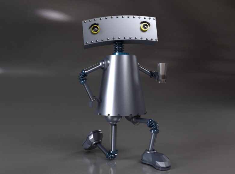 Zdjęcie przedstawia figurkę małego, srebrnego robota.